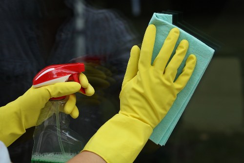 Professional carpet cleaners in Balham deep cleaning a living room carpet