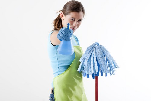 Carpet cleaning technician preparing a safe workspace in Balham